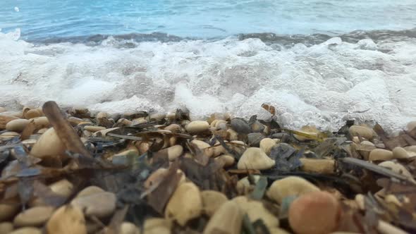 Slow Motion Footage of Waves Breaking on Pebble Beach