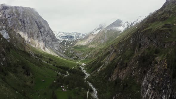 Panoramic View of a Picturesque Mountain Valley with a Village in a Lowland