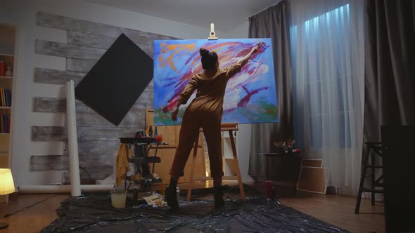 Artist Looking at Painting