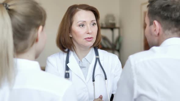 Senior Doctor Talking with Patient
