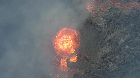 Top down view of a small volcano erupting