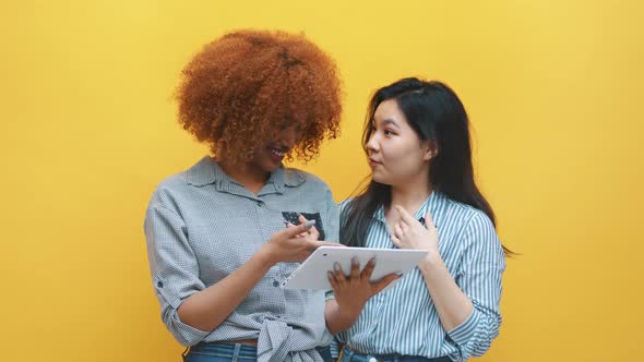 Young Multiracial Friends Browsing Social Media Online with Excited Face Expressions. African