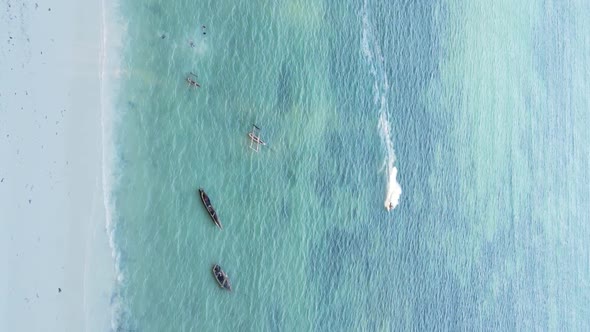 Vertical Video Boats in the Ocean Near the Coast of Zanzibar Tanzania Aerial View