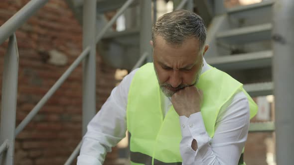 Frustrated Construction Manager Feeling Tired Outdoors