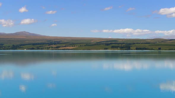 Lake landscape, clouds reflection on water at Lake Pukaki, New Zealand