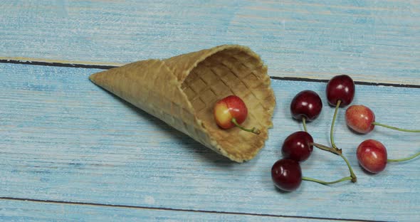 Berry Ice Cream. Berries of Cherry in a Waffle on a Blue Wooden Background