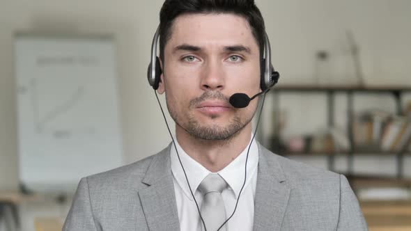 Call Center Man Talking Via Headphones