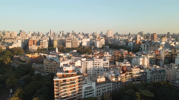 Aerial parallax shot revealing La Recoleta Cemetery in Buenos Aires at golden hour