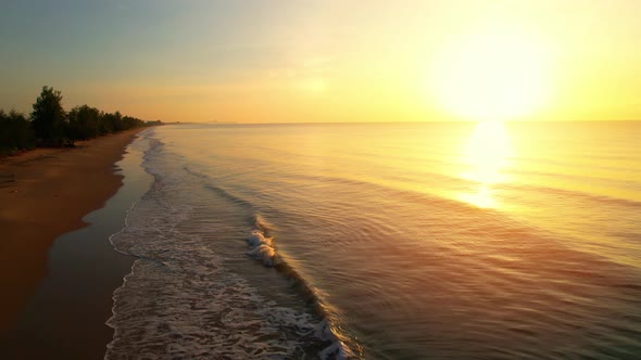 Drones fly over beautiful beaches during sunrise