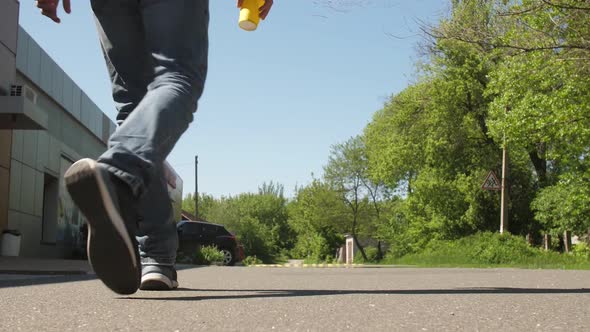 A Man Throws Out Paper Cup on the Ground