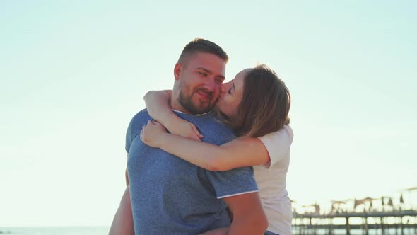 a Man and a Woman in Love Hugging and Having Fun on the Sea Beach