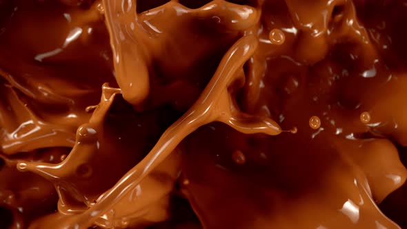 Super Slow Motion Shot of Splashing Melted Caramel at 1000 Fps