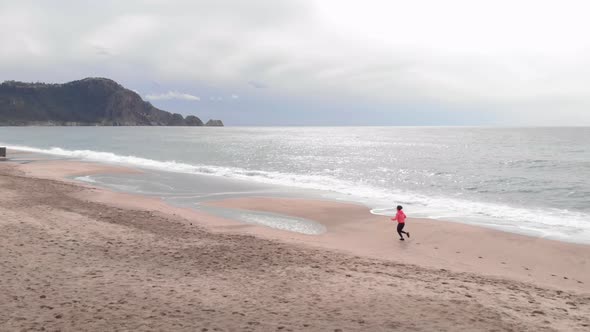 Running at the beach at sunrise