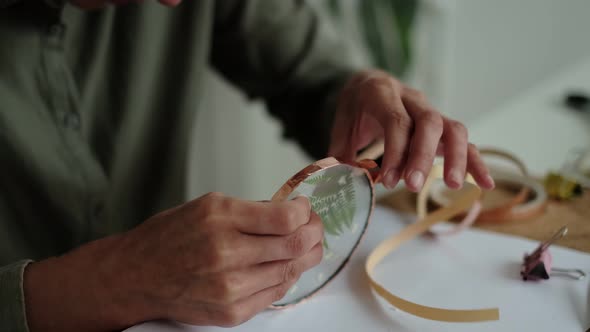 Woman Fixes Glass Plates