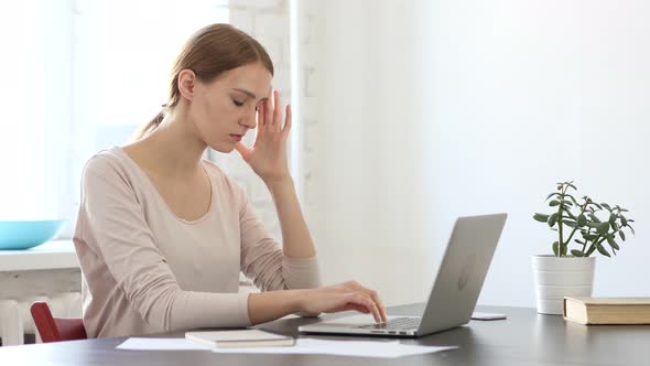 Frustrated Young Woman with High Blood Pressure and Headache