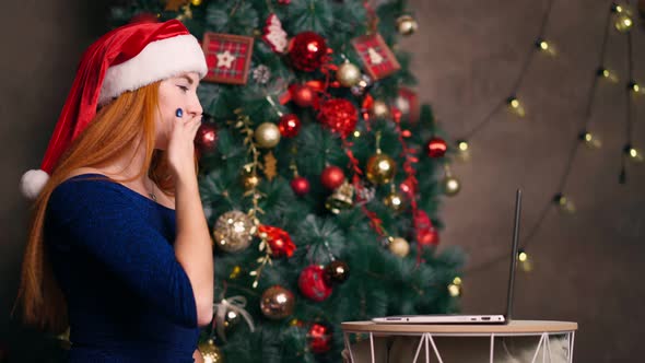 Woman Remote Congratulates Relatives on Christmas By Videoconference on Laptop.