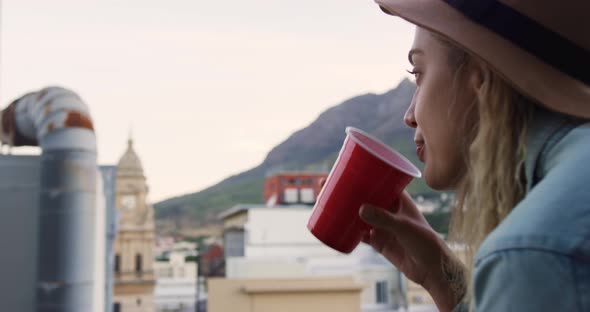 Young woman hanging out on a rooftop