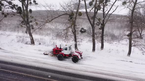 Snowblower Grader Clears Snow Covered Road