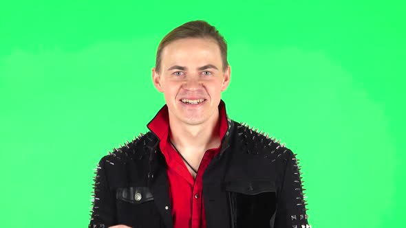 Guy Looking at the Camera with Excitement, Then Celebrating His Victory Triumph. Green Screen
