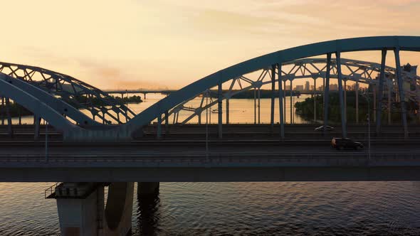 Fast Speed Motion of Car Traffic and Metro Train on the Bridge