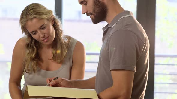 Physiotherapist discussing a medical report with patient