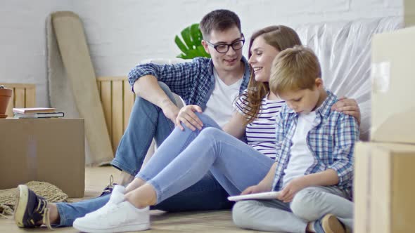 Couple with Son in New House