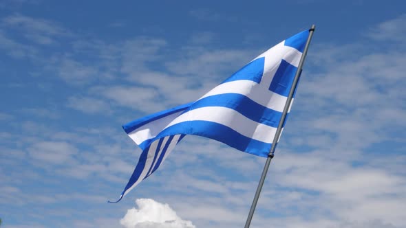 Greece Flag Waving in the Wind in Slow Motion Close Up with Sky Background