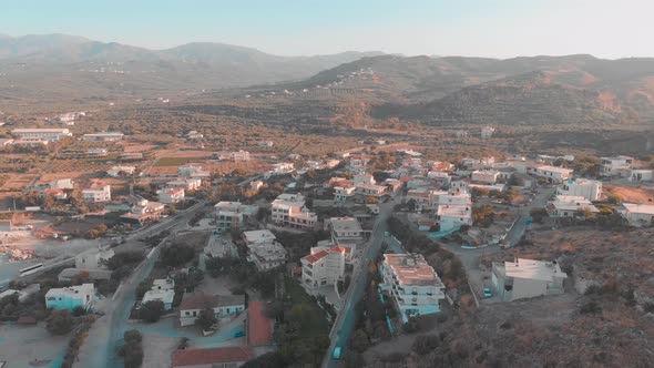 Drone flying over small town in Greek city.