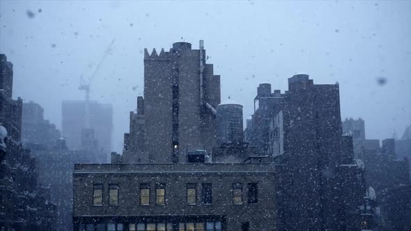 Snow Falling in the City during Cold Winter Weather Season