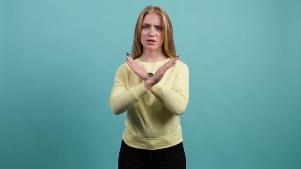 Young Woman Making Stop Gesture, Crossing Her Hands.