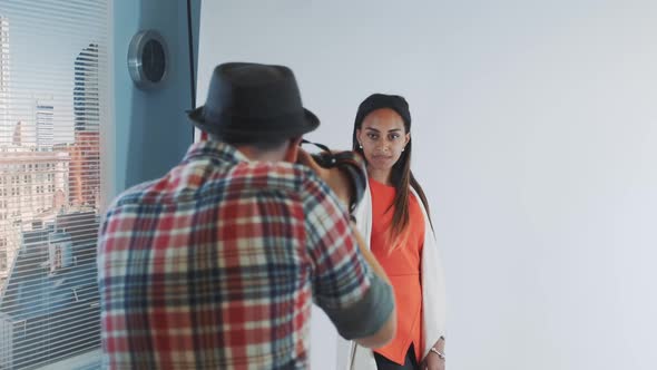 Backside View of Photographer Taking Photo of Beautiful Multiracial Model in Studio