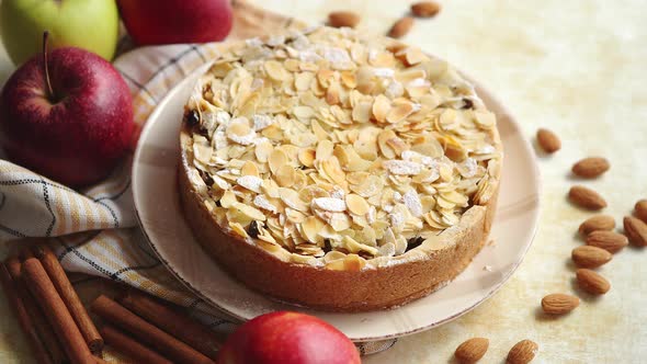 Freshly Baked Homemade Apple Pie with Almond Flakes Cake on Yellow