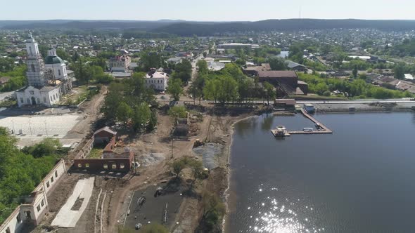 Aerial view of reconstruction of a embankment in the provincial town. 16