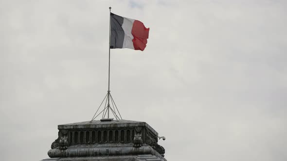 Flag of France waving on a roof