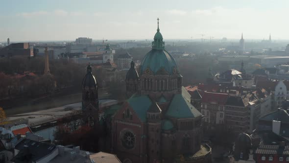 Scenic View of a Cathedral in Winter Sunlight with Green Roof and Church Tower in Munich, Germany