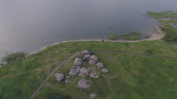 Aerial view of Huge stones (rocks) in a field near the lake 09