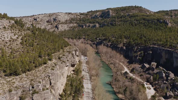 Drone view of road and river in a canyon in Cuenca, Spain