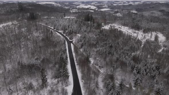 Highway travelling through beautiful winter landscapes and forests in the rural countryside of West