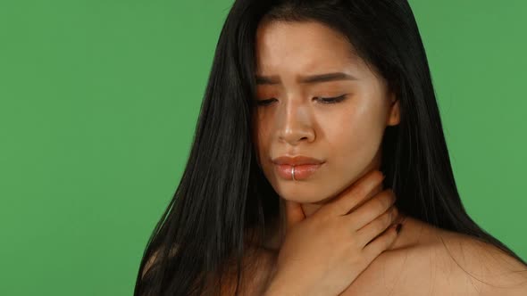 Beautiful Asian Woman Feeling Sick and Coughing on Green Chromakey