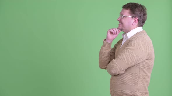 Profile View of Happy Overweight Bearded Man Thinking