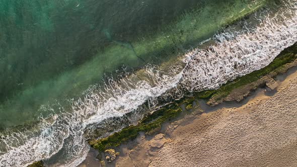 Texture of the rocky beach aerial view 4 K Turkey Alanya