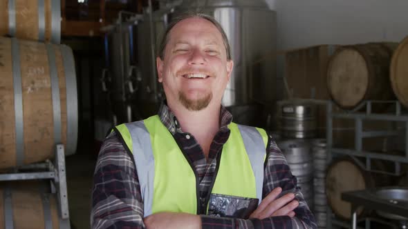 Caucasian man smiling at camera and wearing high visibility vest