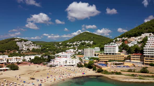 Aerial footage of the Spanish island of Ibiza showing the beautiful beach front and hotels