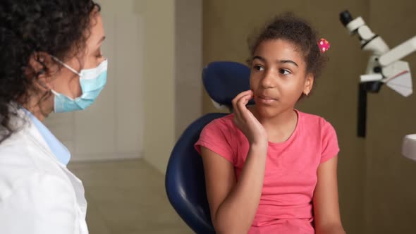 Girl Patient Complaining of Toothache at Dentist