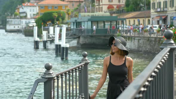 A woman traveling in a luxury resort town near Lake Como, Italy, Europe