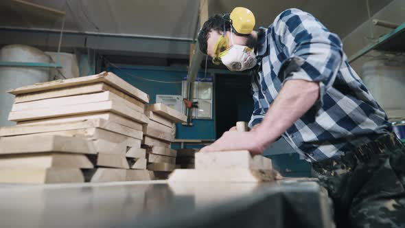 A Man Works with a Planer