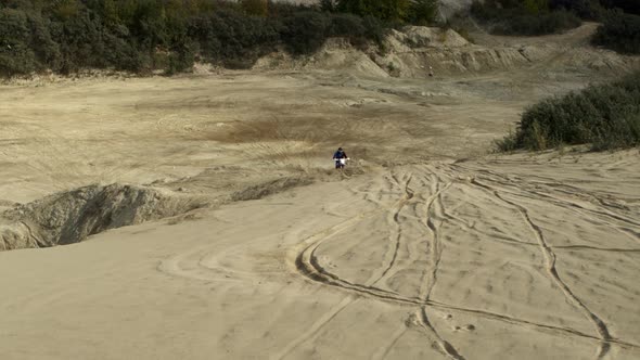 Enduro Motorcycle Rides Offroad on the Sands