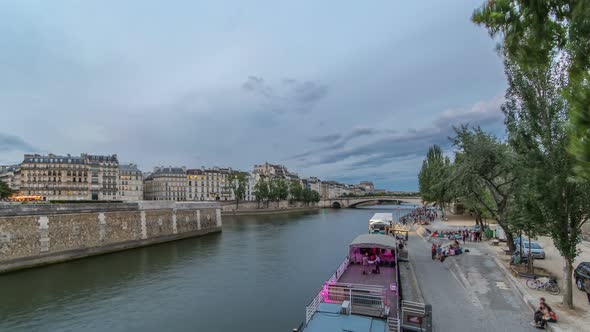 View to the Pont De La Tournelle on the River Seine Day to Night Timelapse with Waterfront