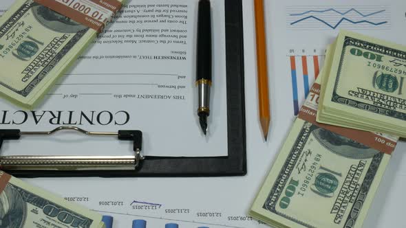 Business Contract And Money On The Table In The Modern Office Of The Company