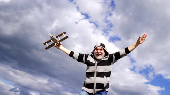 Happy Old Man Smile Playing with Toy Plane in Sky Flying